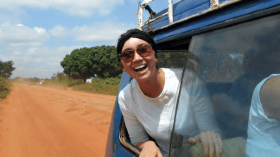 Woman Sticking Head Out of Window