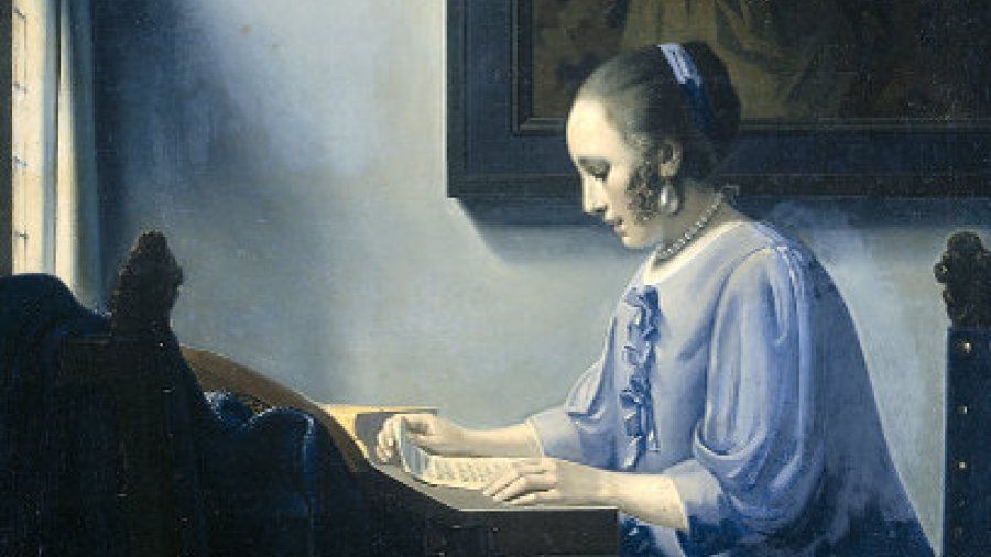 woman reading music