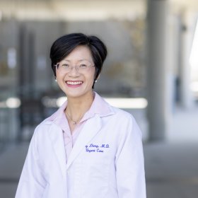 Woman doctor in white lab coat