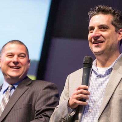 Damen and Dan Lopez giving a presentation on their organization TurnAround Schools