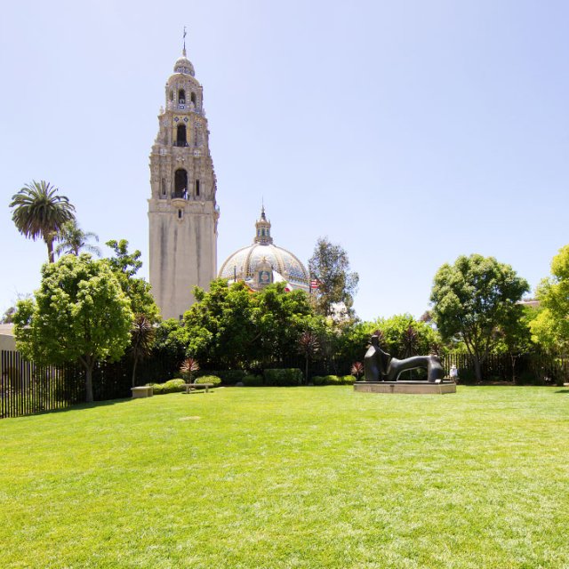 California Tower in Balboa park from a distance over a large grass lawn