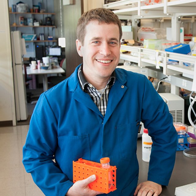 Evan Miller shows off a research experiment in his lab.