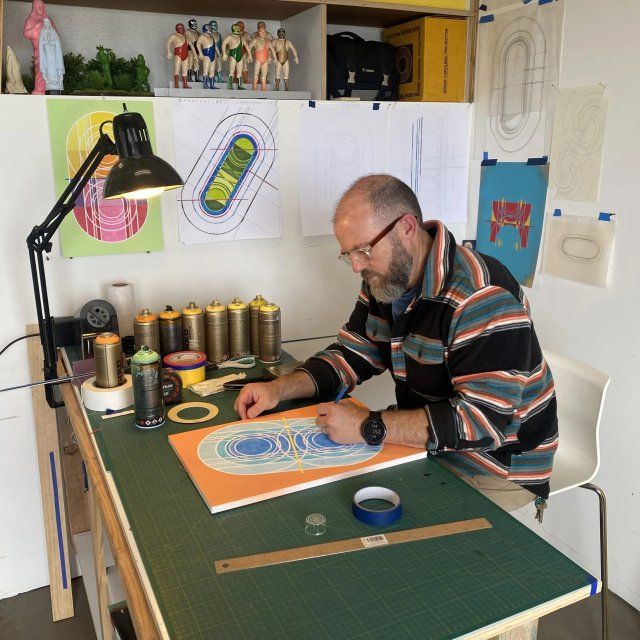 David Carlson works on an art project in his studio