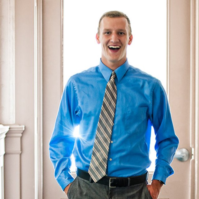 Ian McKay smiles as he gets ready for his headshot.