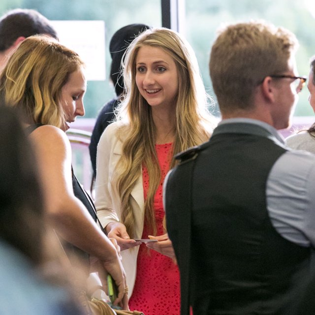 PLNU Student Dialoging with Other Students at Event