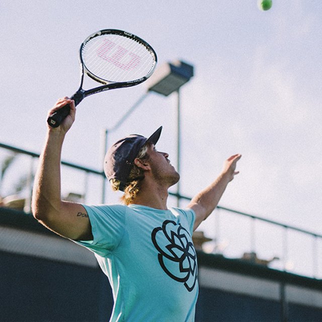 A student plays tennis in the annual Psychology department tennis tournament