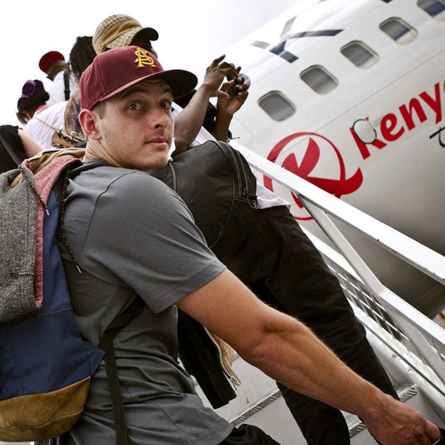 Student boards a plane for a LoveWorks mission trip.