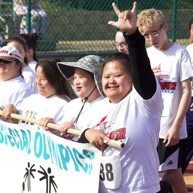 Athletes march in the opening ceremony of the Special Olympics at the PLNU track and field in San Diego