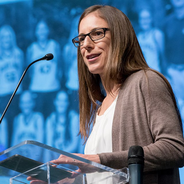 Nell Becker Sweeden speaking at a conference.