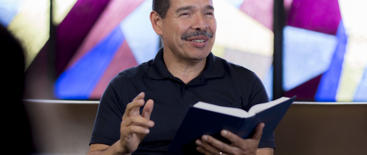 Professor teaches from the bible in Smee Hall.