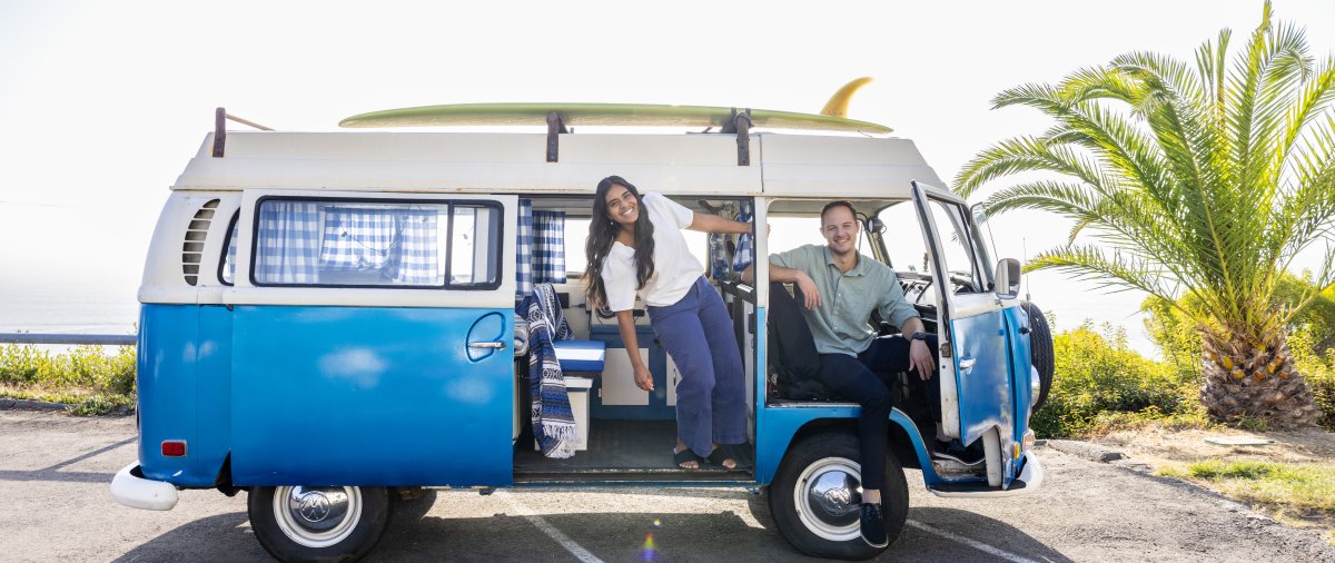 Two PLNU admissions counselors in a VW surf van