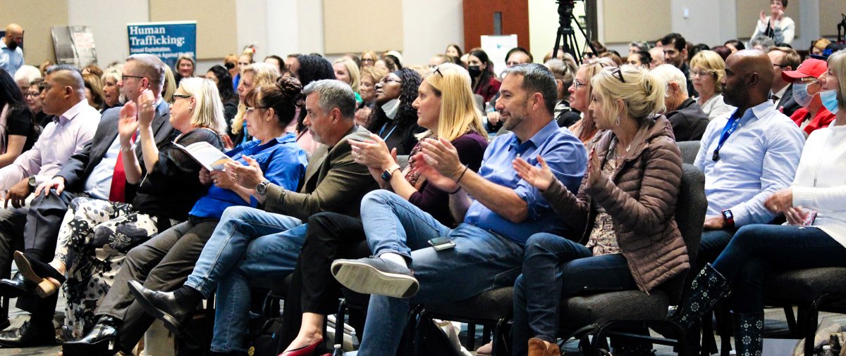 Crowd attends and listens at the CJR Summit