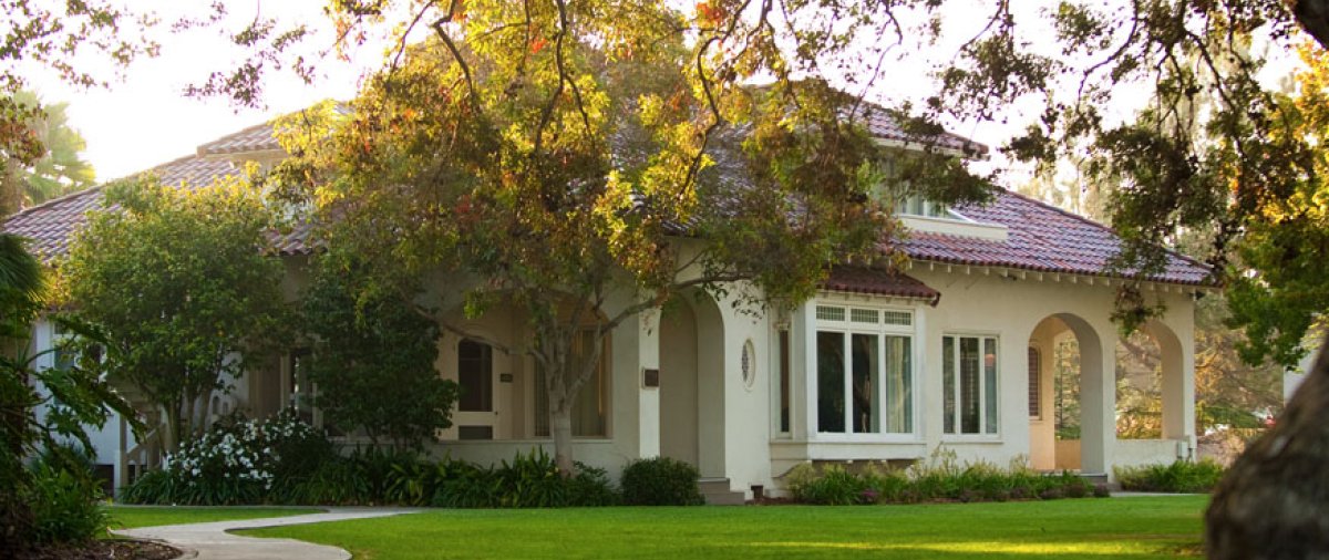 The morning sun rises over the PLNU Alumni House