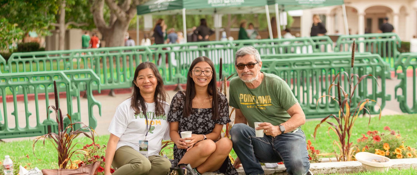 Student with Parents on the lawn