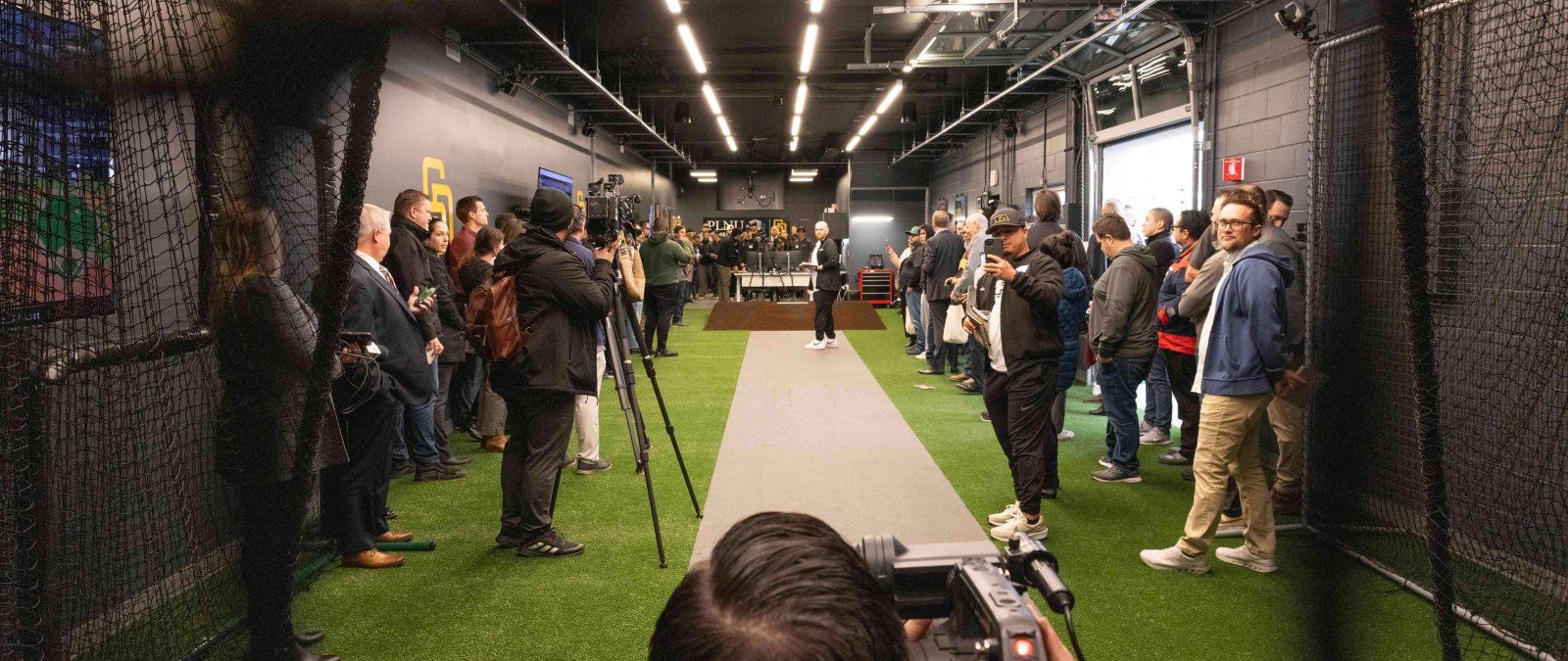 Image of camera man filming at the pitching lab