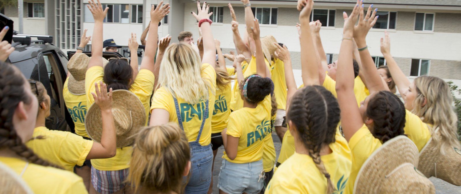 PLNU students cheer and celebrate a new student at NSO.