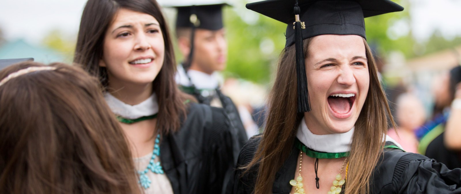 Graduate student celebrates after receiving her diploma