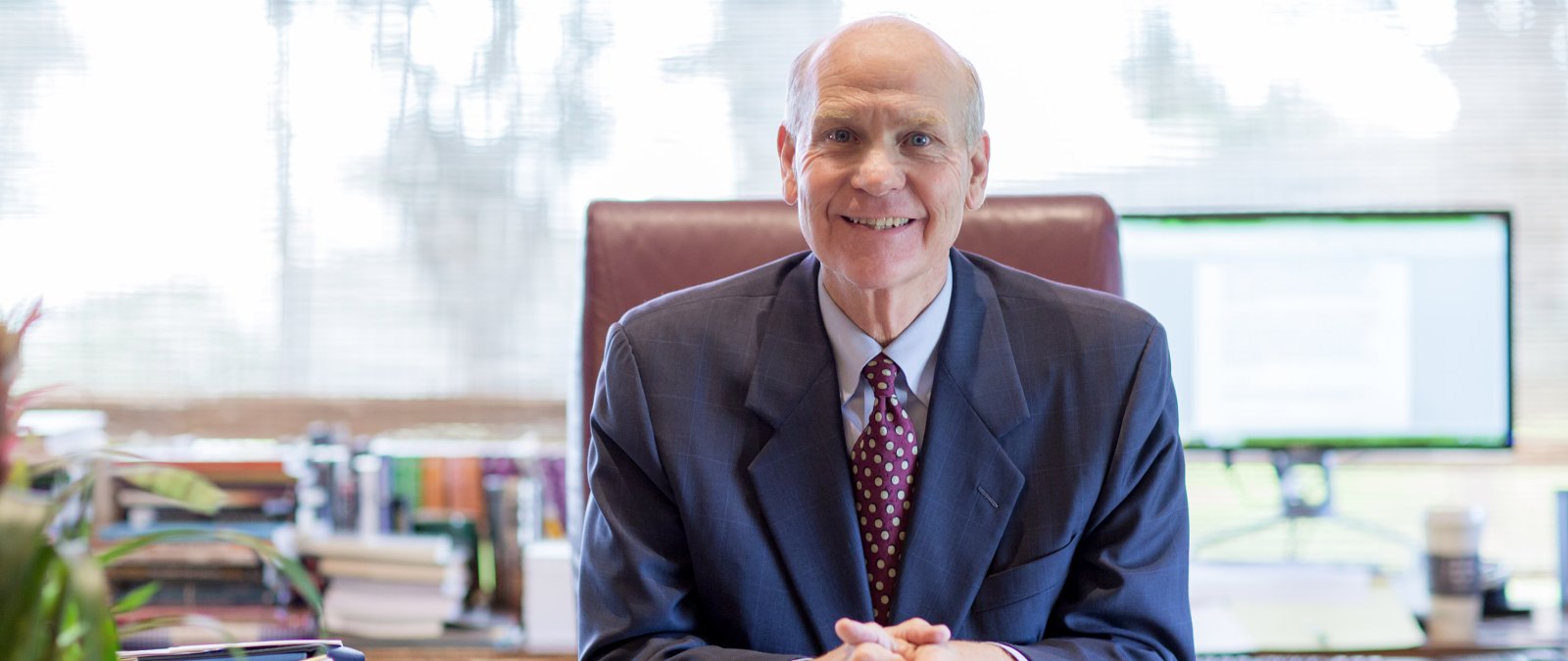 PLNU President Dr. Bob Brower at his desk in Mieras Hall