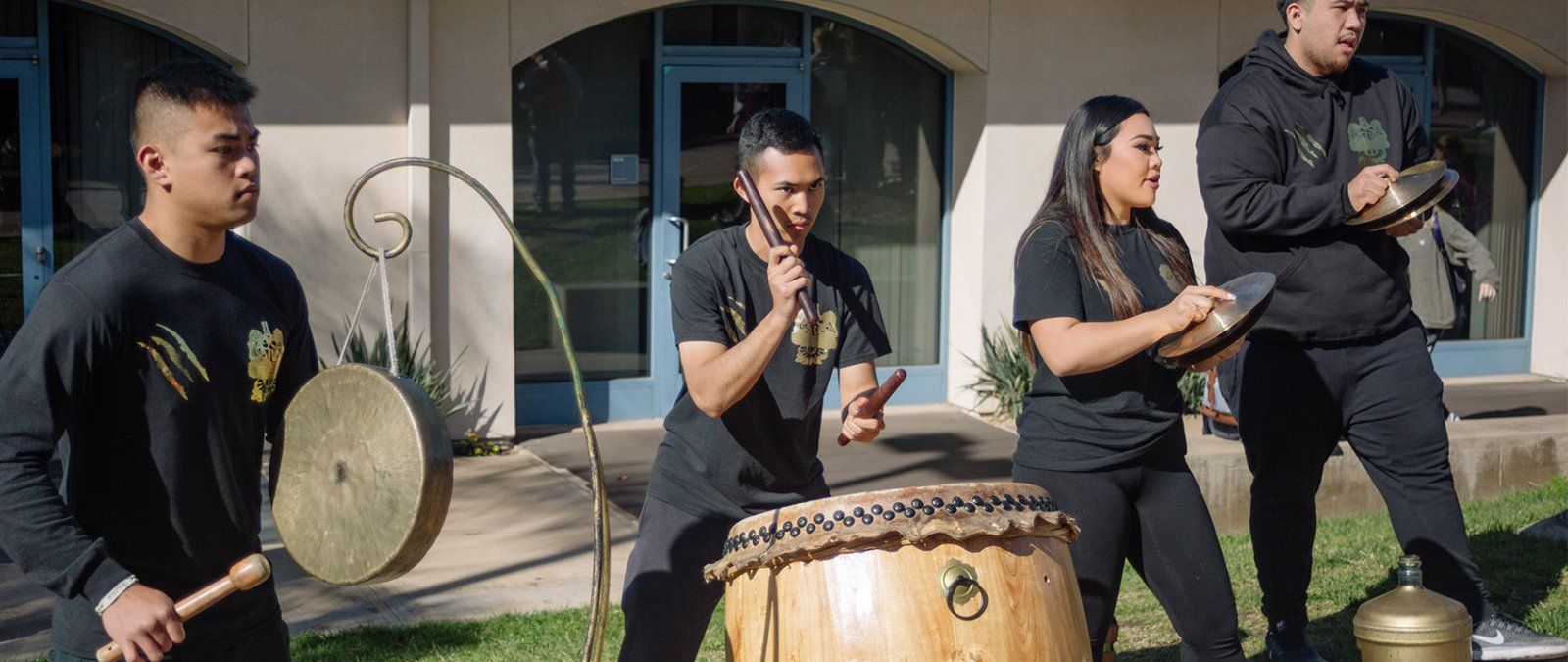 The Asian Student Union club performs with drums and cymbals on the Campus Mall