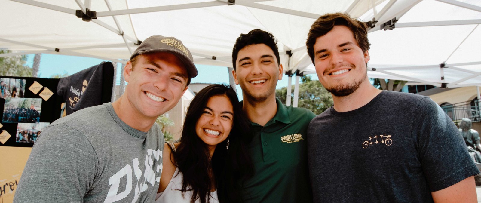 A group of students smile together