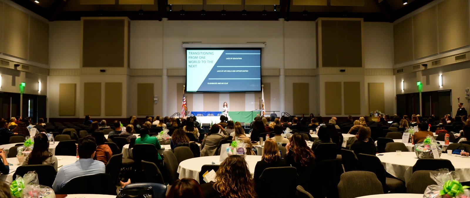 A conference room filled with people 