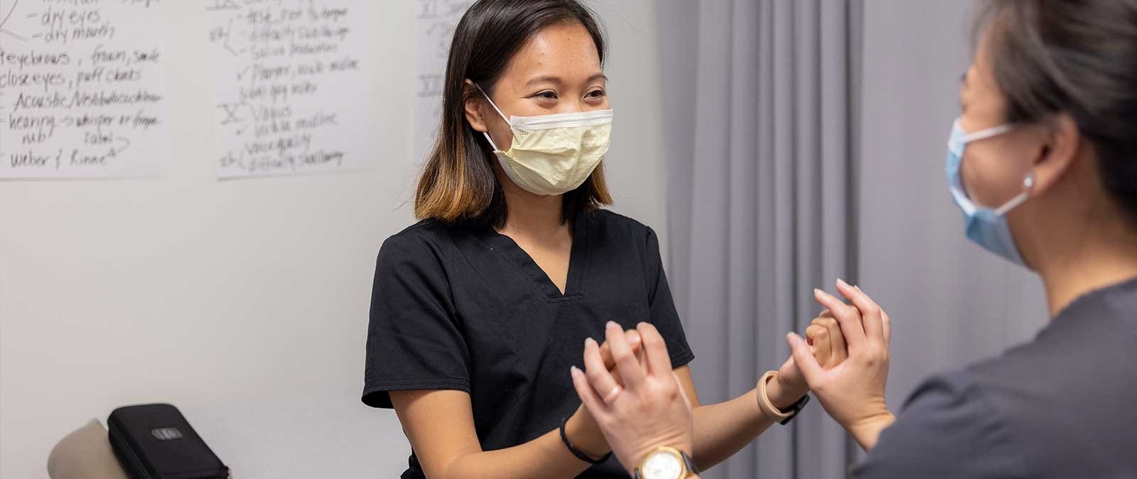 A PA student does a health exam on a patient