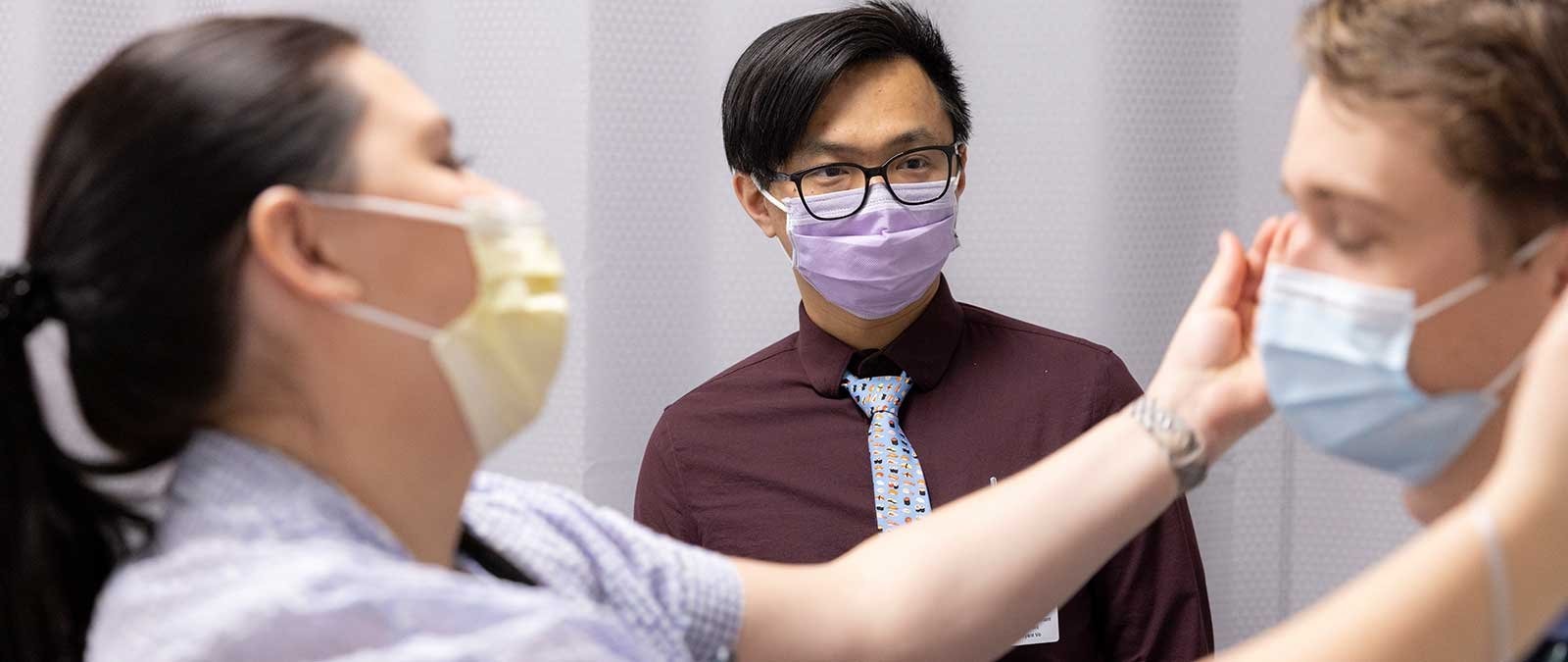 A PA student looks on during a health instruction