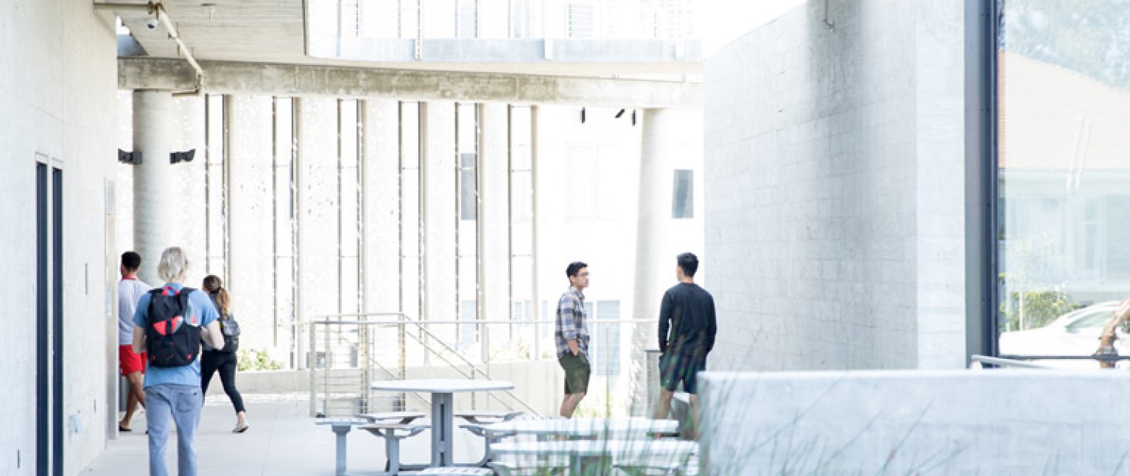 Students walk into the science building on PLNU's campus.
