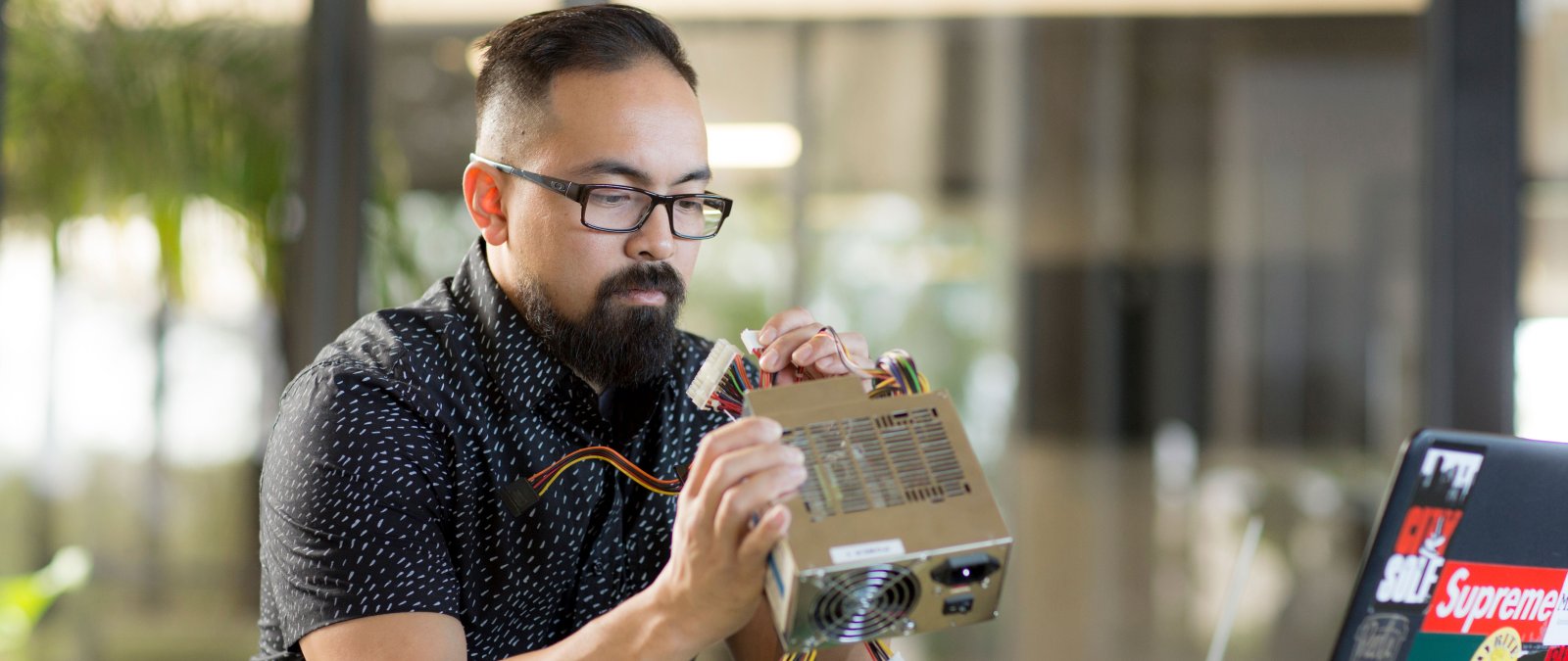 student working on an electrical gadget