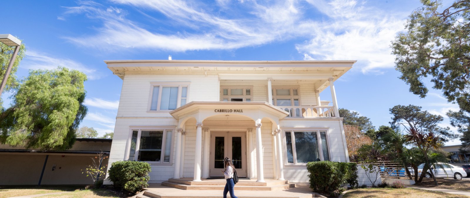 student walking in front of cabrillo hall