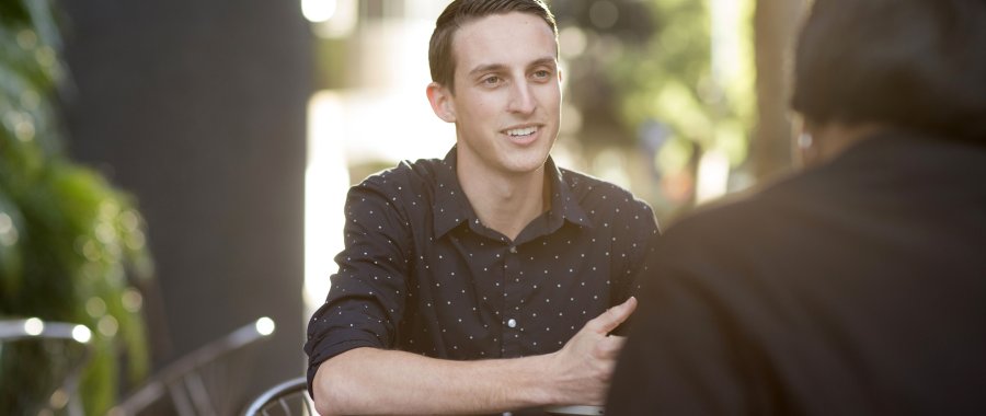 Business student runs an informal meeting as part of PLNU's bachelor's and master's degrees in business and leadership.