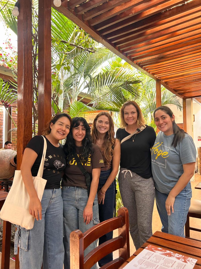 Women pose together on a trip to Peru to conduct field research.