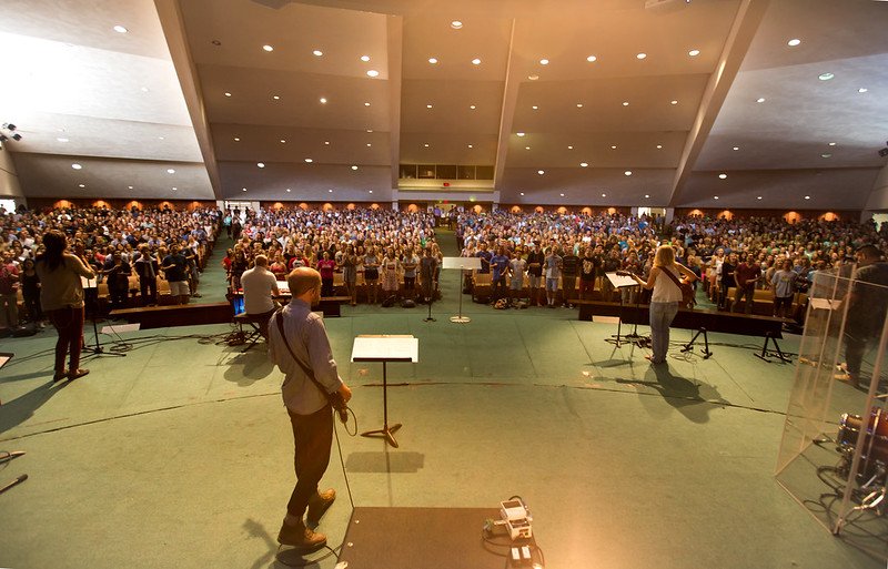 A packed crowd of students worship in PLNU's Brown Chapel