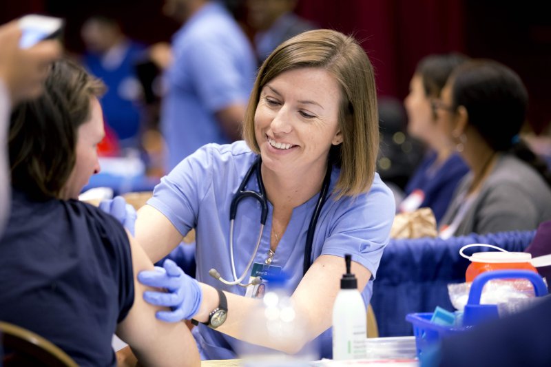 Nurse helping patient 