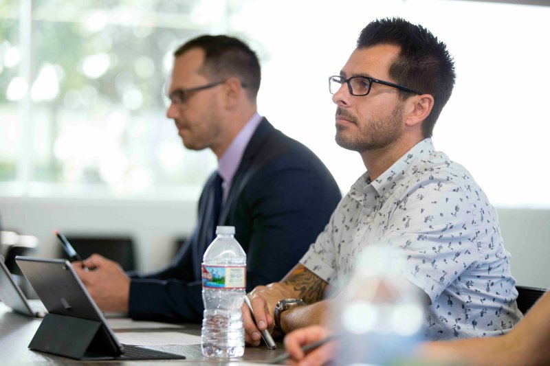 An PLNU adult students sits in class and learns.