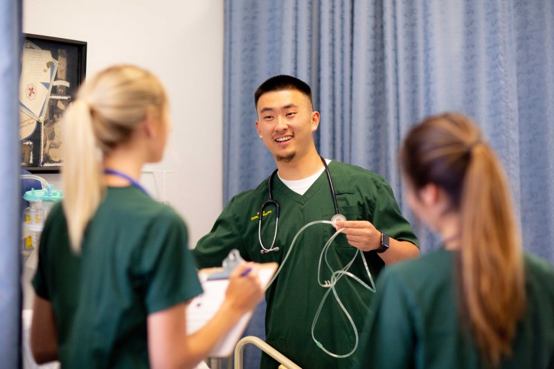 Nursing students have a conversation in class