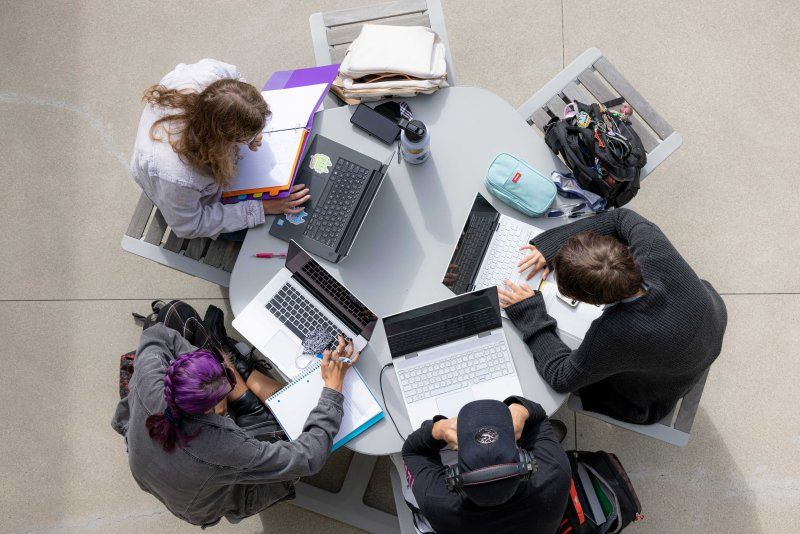 birds eye view of students studying at a round table 