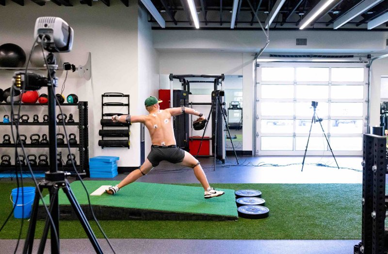 PLNU pitcher throws at the pitching lab