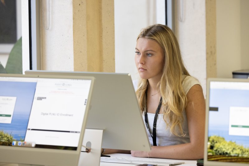 PLNU student working on computer at the Ryan Learning Center during Welcome Week.