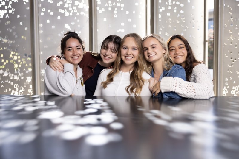 Undergraduate students sitting at the Rohr building