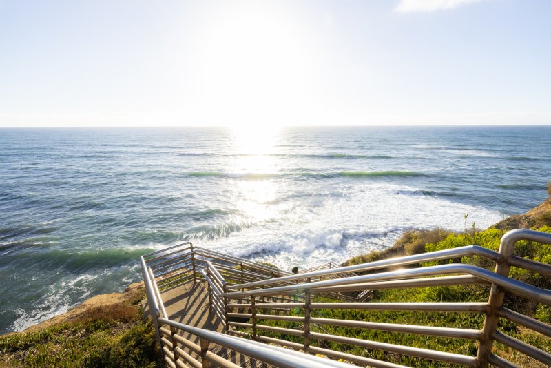 Stairs lead down to the ocean