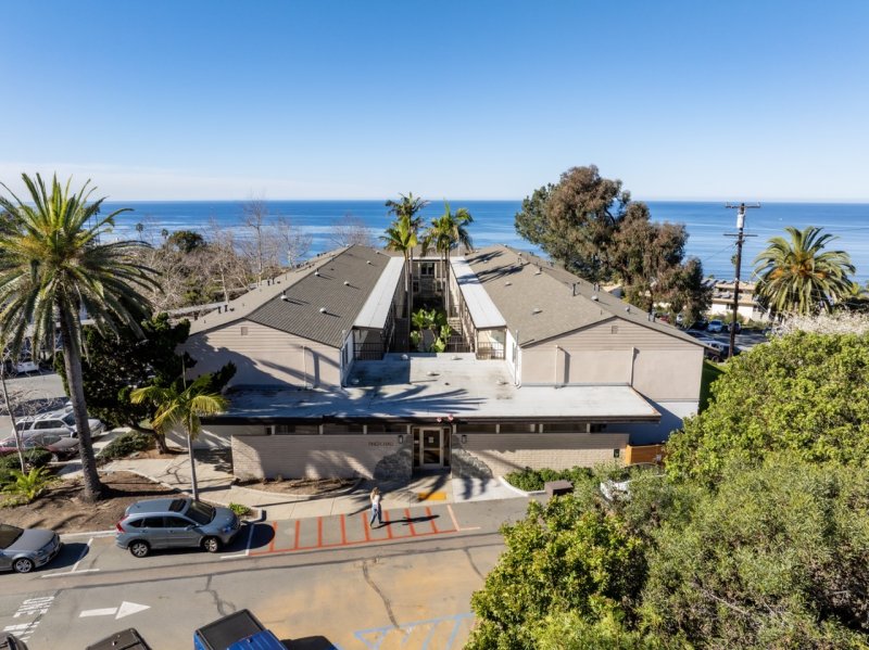 Aerial view of Finch Hall as it sits above an ocean view.
