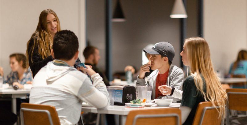 Students chatting in the cafeteria