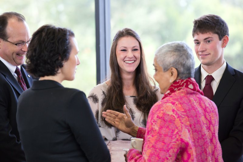 PLNU students networking at a informational event.