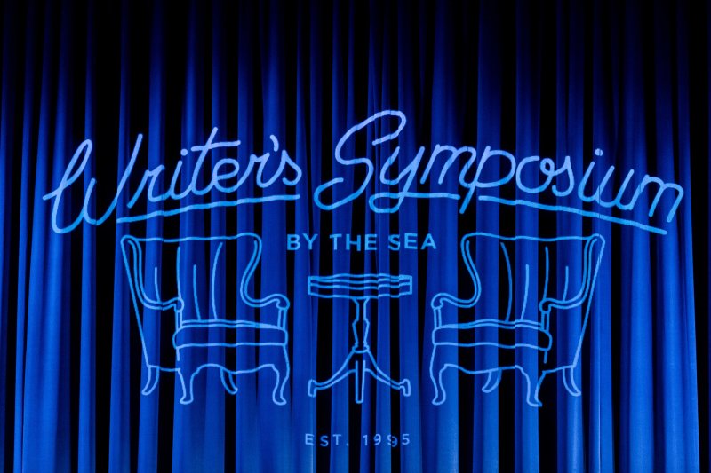 Writer's Symposium image on blue curtains in Crill