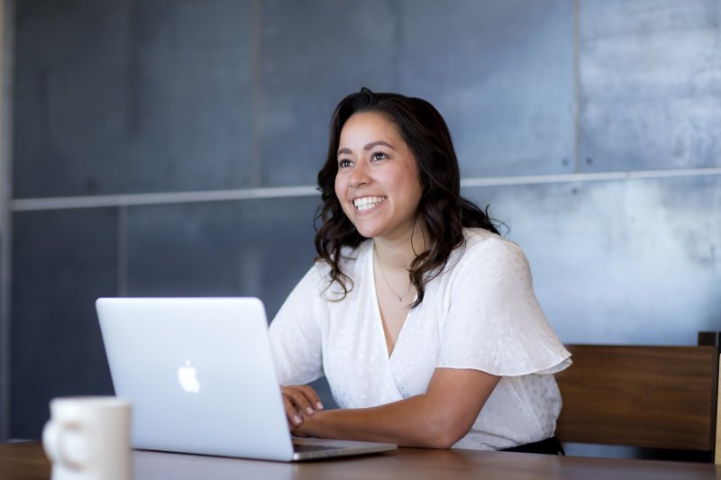 Female MBA student working on laptop