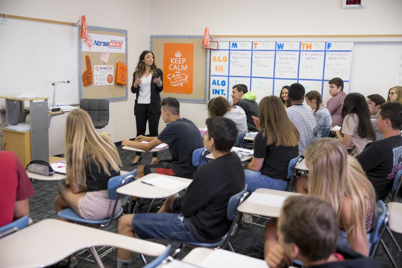 Teacher teaching high school class