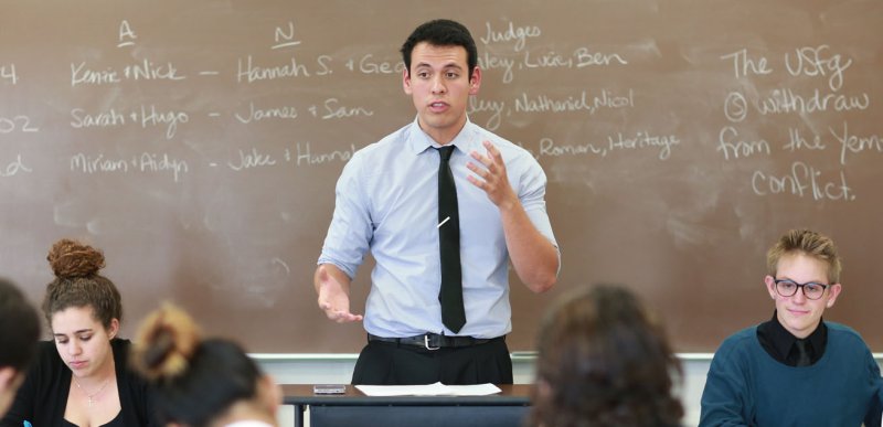 The Speech & Debate team practices in a classroom