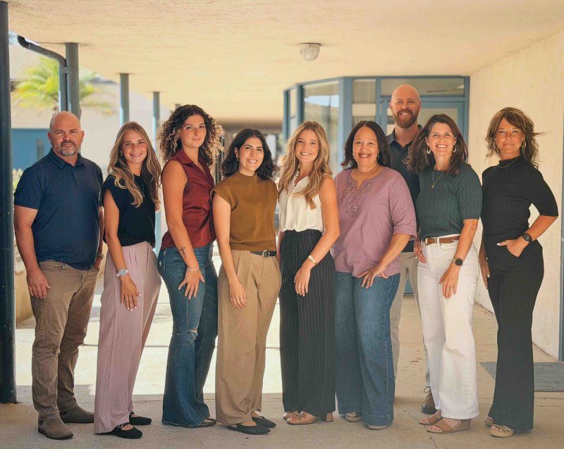 PLNU's Counseling Services Team for the 2026-2027 year pose for a shot in halls of Evans Hall.