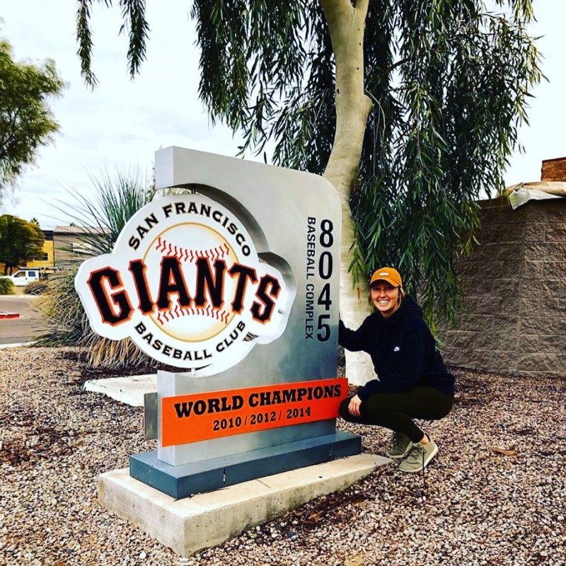 Ogren next to Giants sign